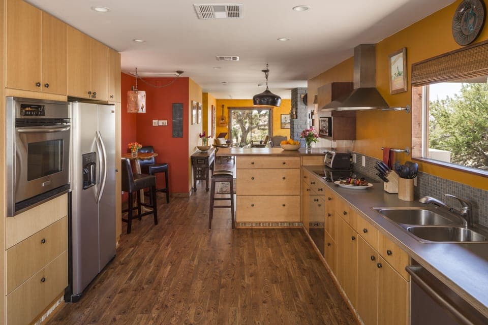 Fully stocked kitchen & bar area.
