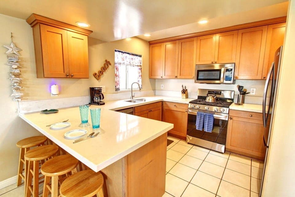 Quartz counters and stainless steel dishwasher and refrigerator