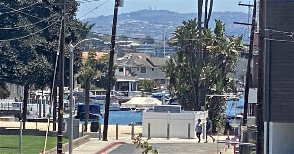 Peek a boo view of Newport Bay from living room and dining table of upper unit.
