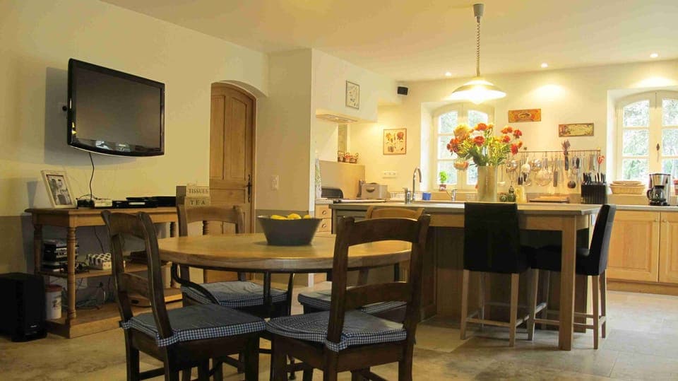 eat-in kitchen with a large TV