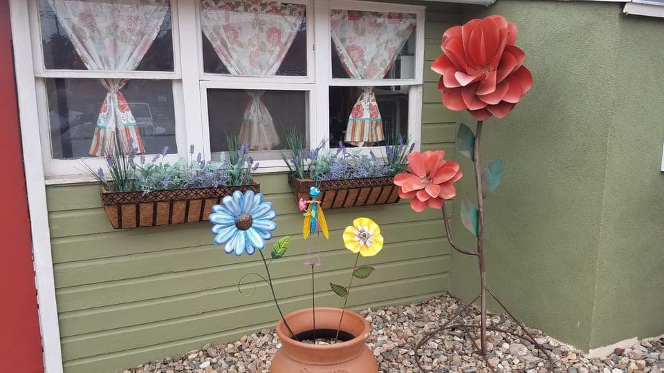 Fun Ornamental Flowers and Artwork throughout the yard!