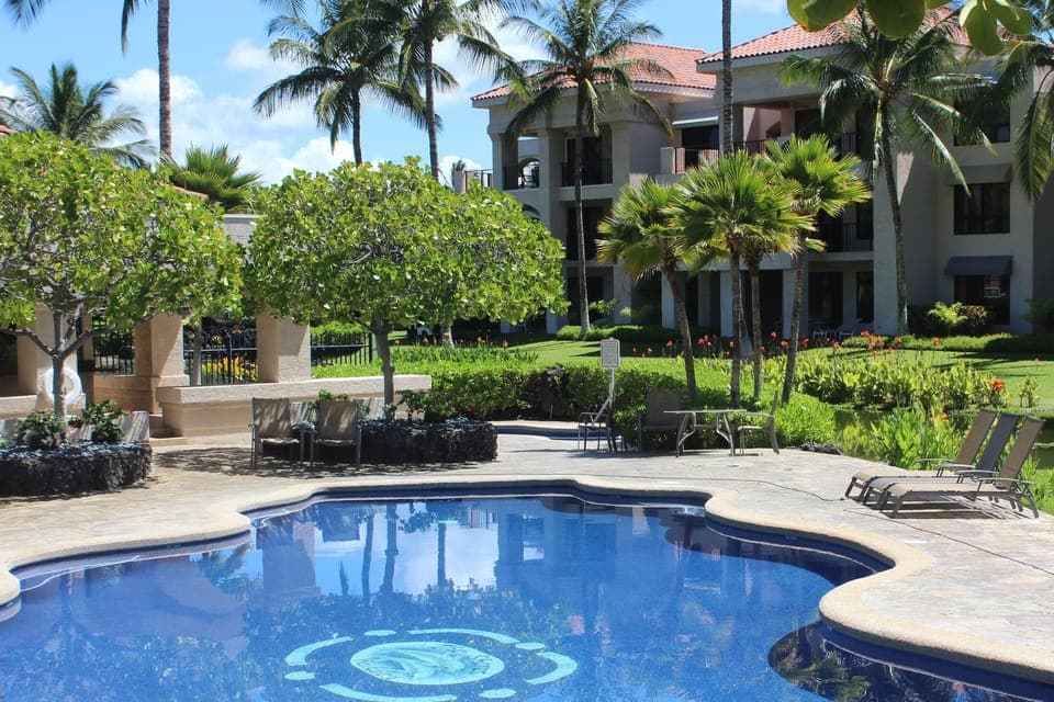 Relax by the pool just a steps from the front door.