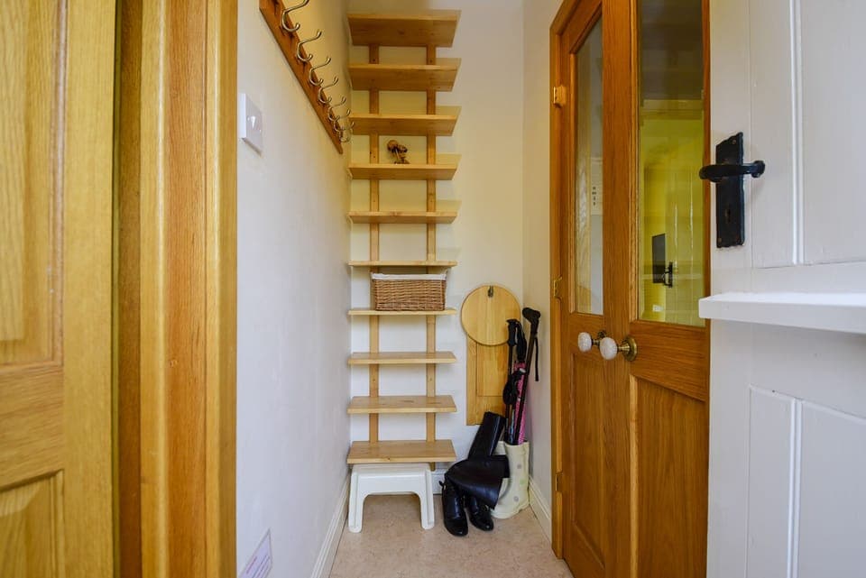 Hallway by back door for shoes & coats
