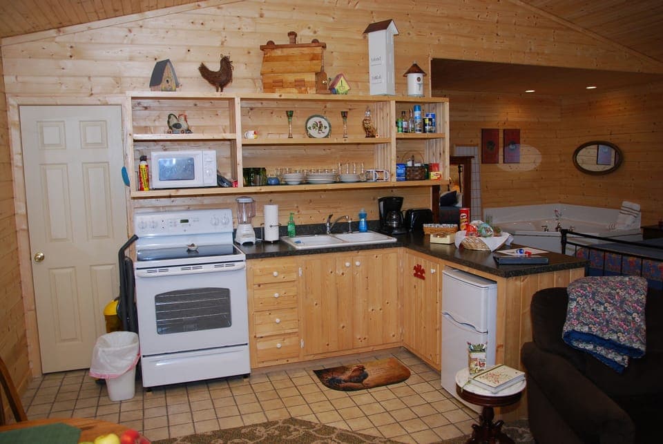 View of fully equipped kitchen area