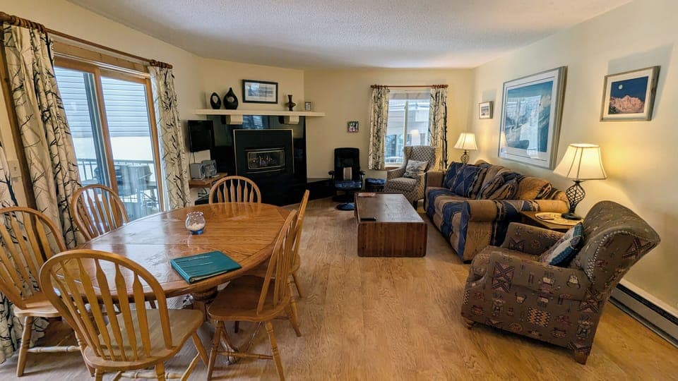 Living room with sofa bed, gas fireplace, and patio w/ propane BBQ grill