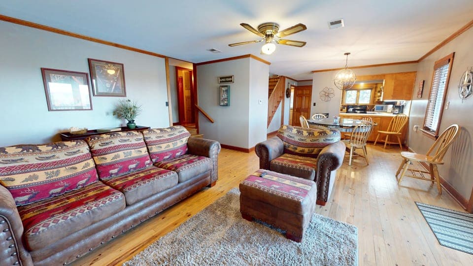 Main floor - open plan with living room, dining, and kitchen area.  