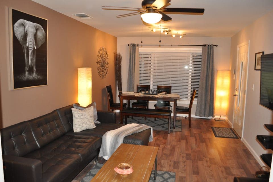 Open Concept Living/Dining Room 55'' Smart Plasma TV and Top Grain Leather Sofas