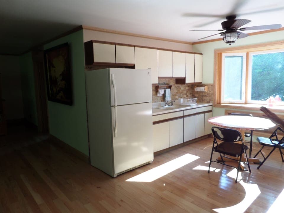 Kitchen area of studio, has dish service for 6