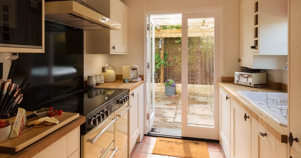 The very well equipped kitchen includes dual washing machine and tumble dryer.