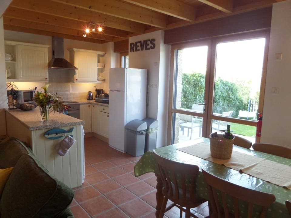 Fully equipped kitchen opening onto terrace/garden