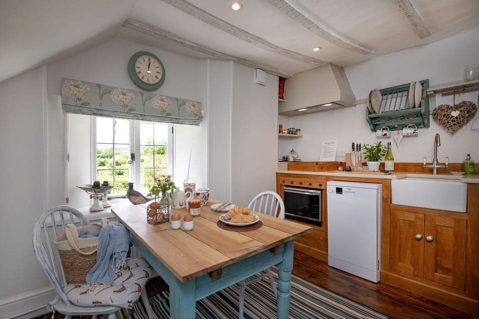 Mid floor: The well-equipped kitchen with many original features and dining area