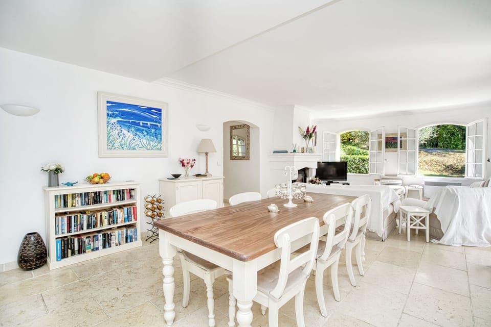 Dining area with French windows leading onto the terrace.