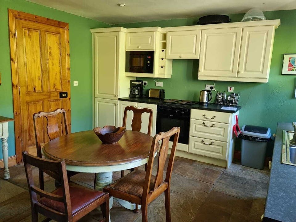 Kitchen table, range, microwave, refrigerator/freezer