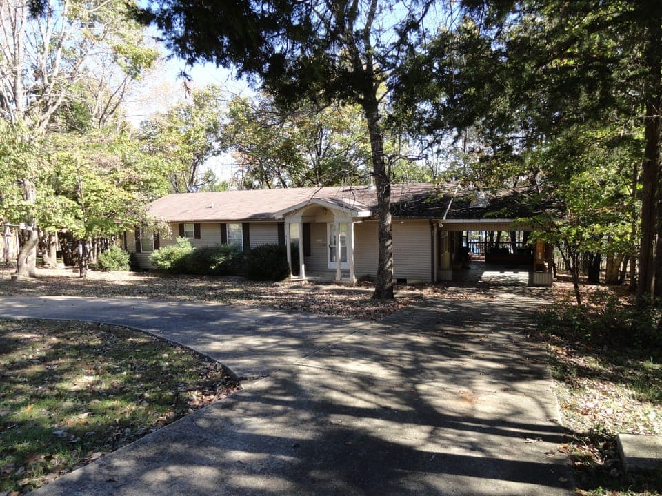 Front of House & circular concrete driveway with plenty of space for parking!