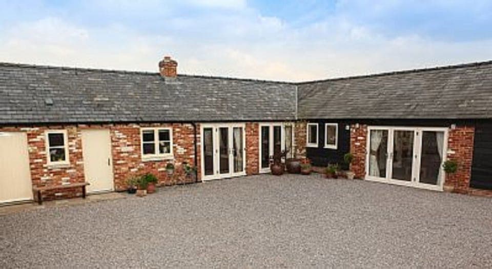 Courtyard showing Txoko Cottage (left) and Little Owls Cottage (right)