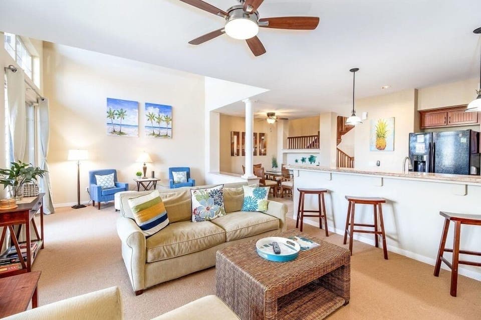 Open concept layout blends the comfortable living area with kitchen and dining spaces.