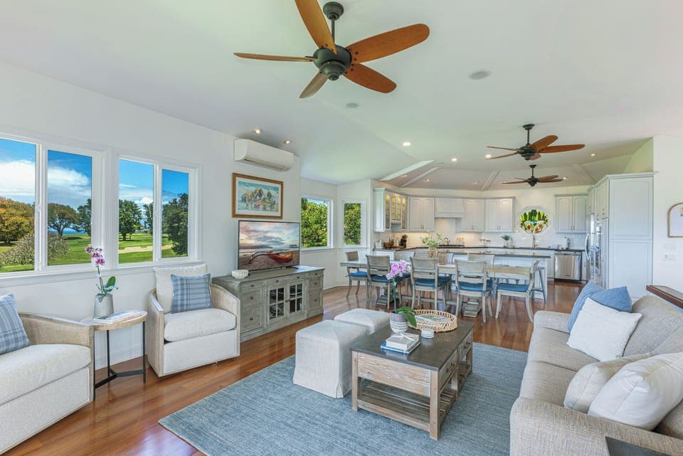 Open-concept living and dining area with serene golf course views and plenty of space for entertaining or family time.