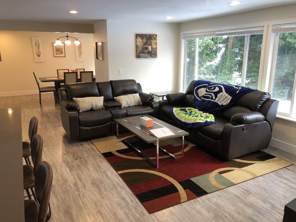 A reclining sofa and love seat provide a comfortable space for relaxation