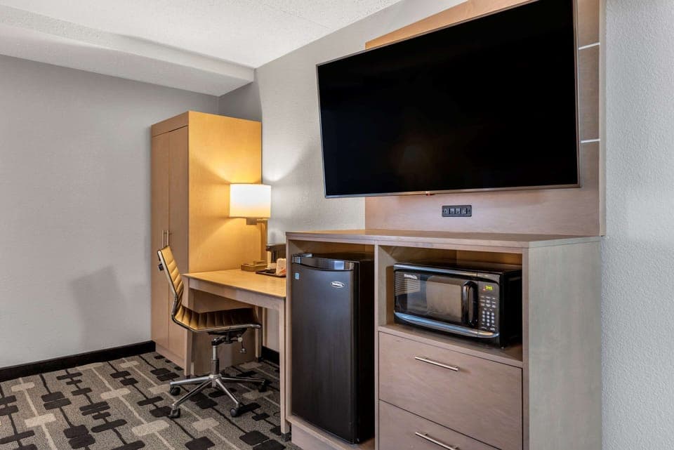 Hypo-allergenic bedding, desk, laptop workspace, blackout drapes