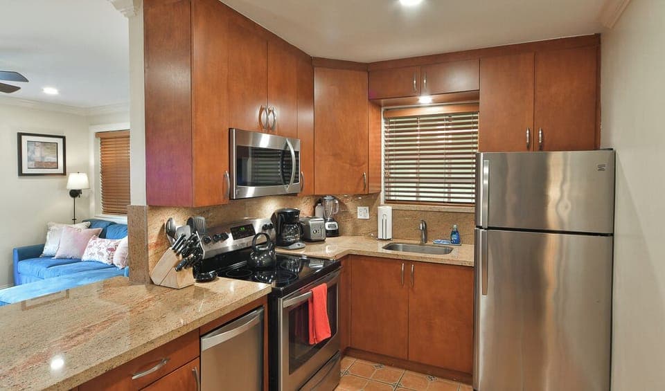 Kitchen with Coffee Maker, Toaster, Blender, Dishes, Pots, Pans, Storage Containers