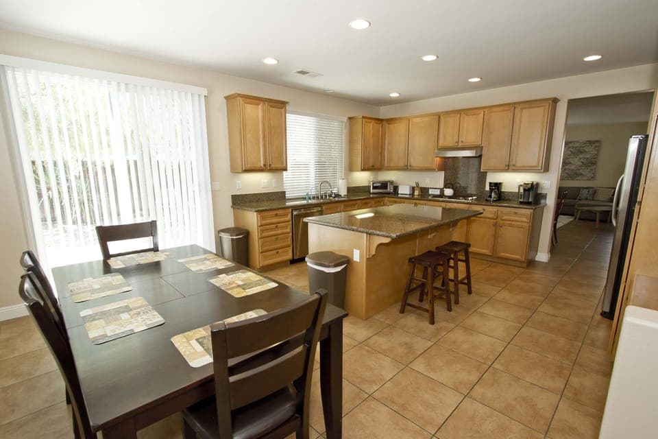 Breakfast nook adjoining kitchen with 6 person dining table