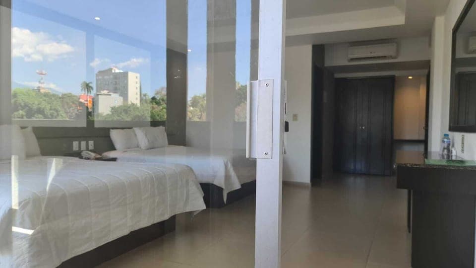 Family Quadruple Room, 2 Queen Beds, Courtyard View (Pet friendly) | Desk, blackout drapes, iron/ironing board, free WiFi