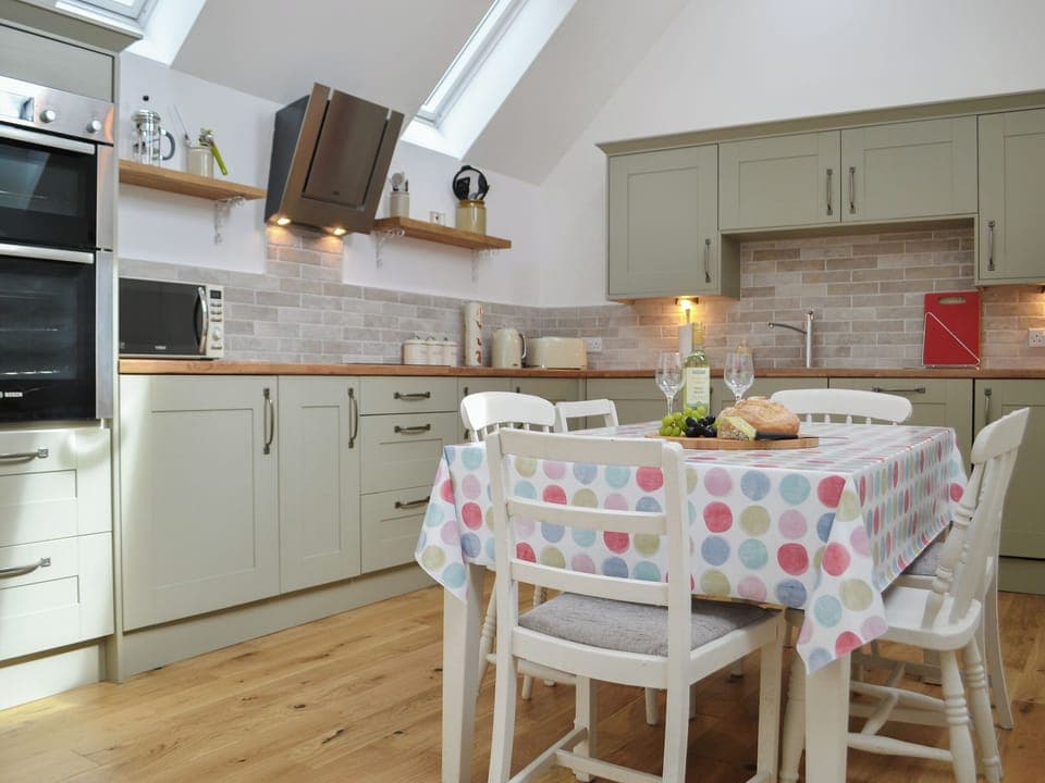 Well equipped kitchen with breakfast area | Wester Laggan Cottage, Dulnain Bridge, near Grantown-on-Spey