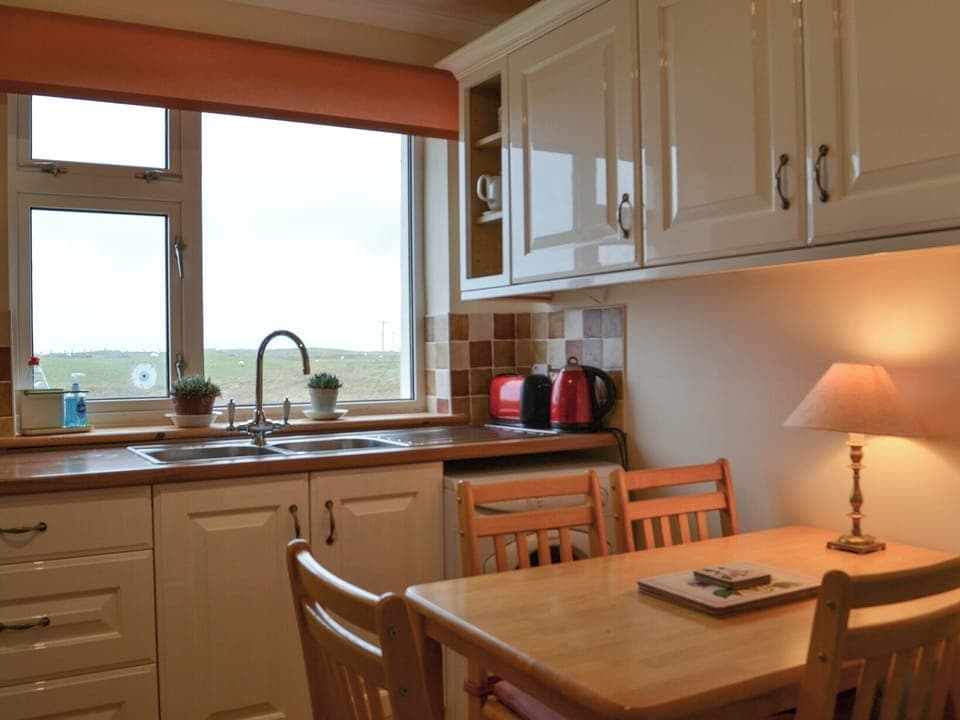 Kitchen with dining area | Padraig&rsquo;s Cottage, Howbeg (Tobha Beag), Isle of South Uist