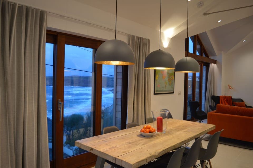 Looking down at the rolling waves and the beach from the dining table