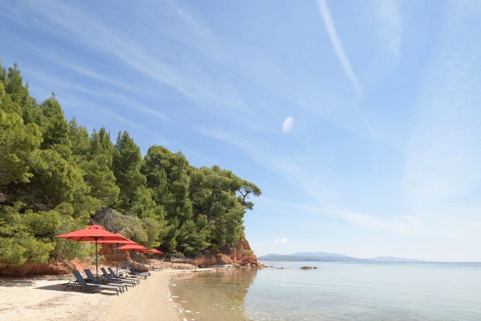 Private beach, black sand, sun loungers, beach umbrellas