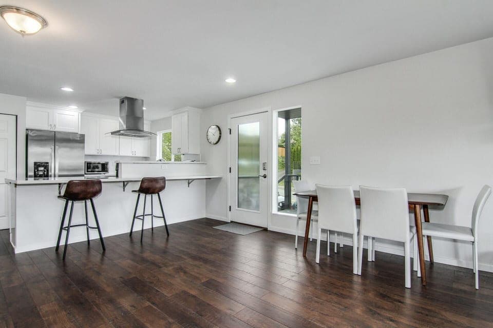 Dining table seats up to 6 and large kitchen island for hosting.