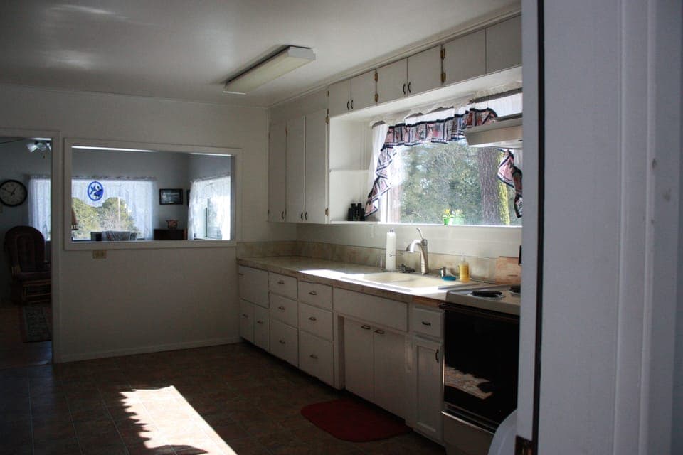 Welcome to the kitchen, fully stocked with dishes and cookware.