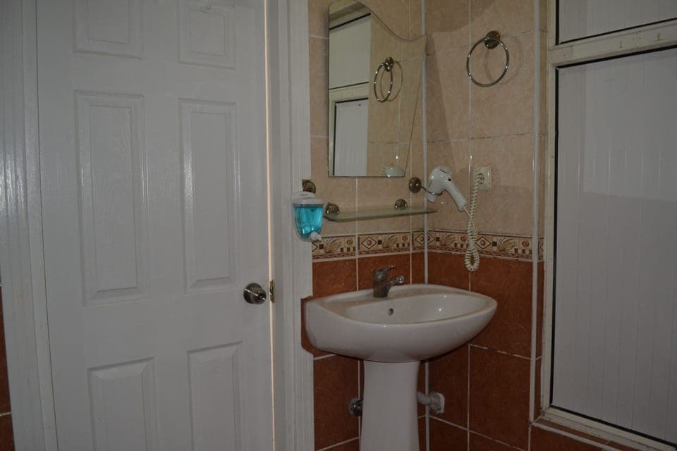 Shower, free toiletries, hair dryer, slippers