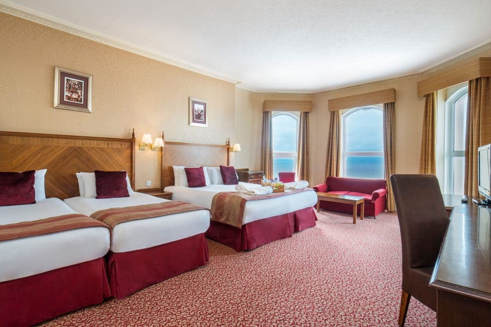 Deluxe Quadruple Room, Sea View | 1 bedroom, individually decorated, individually furnished, desk