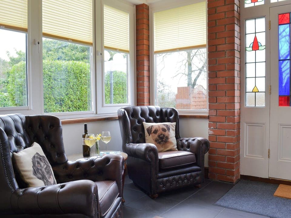 Comfortable seating area by the front door | Cranford House - Cranford and The Coach House Cottages, Cranford, near Clovelly