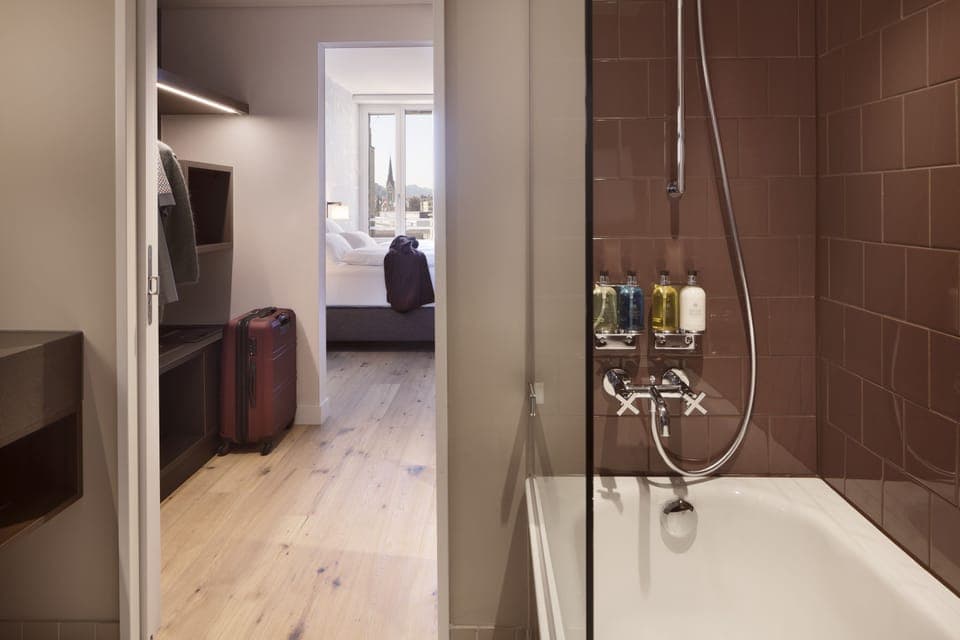 Rainfall showerhead, designer toiletries, hair dryer, towels