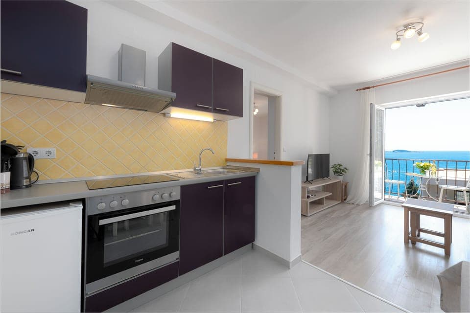 Apartment, Sea View | Private kitchenette | Fridge, coffee/tea maker, cookware/dishes/utensils, dining tables