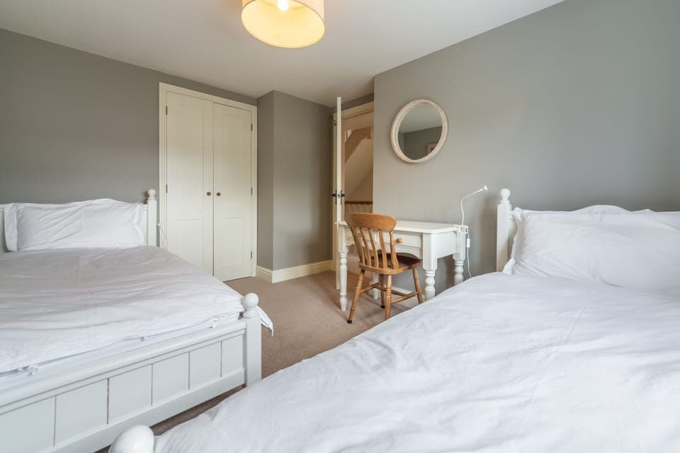 First floor: Bedroom three with twin beds