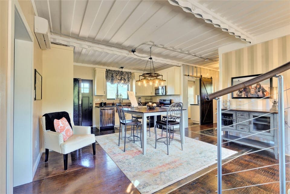 Looking from the spiral staircase into the classy kitchen!