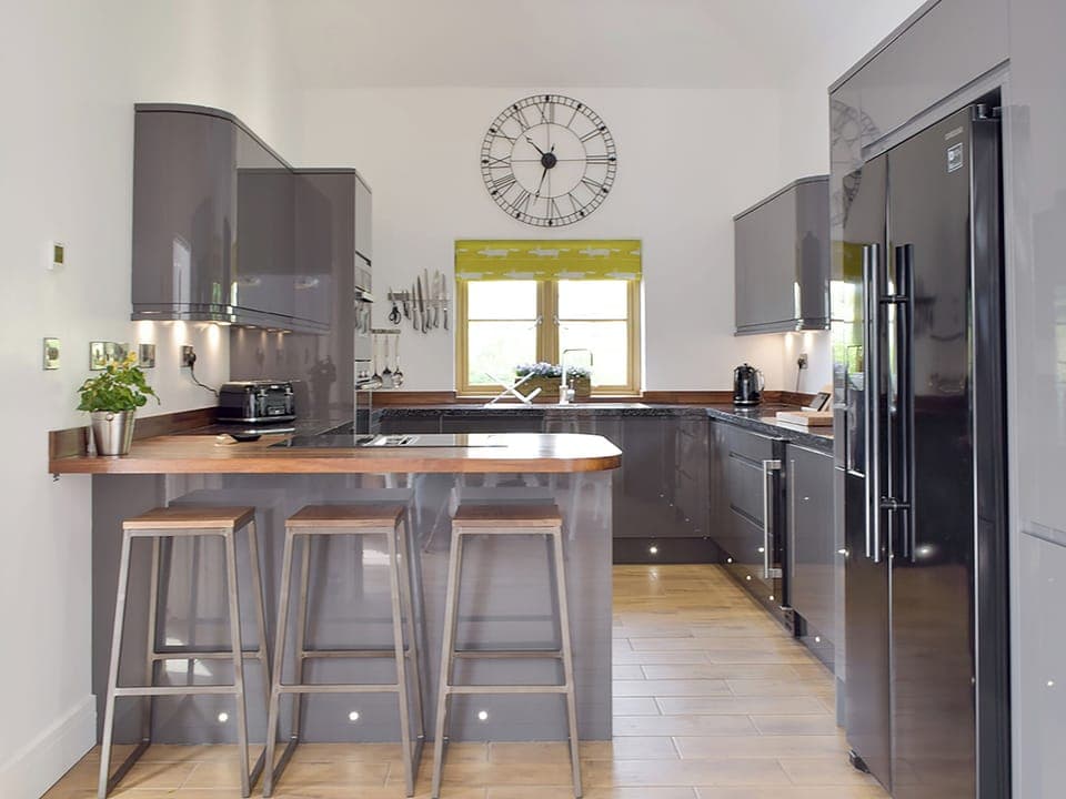 Well-equipped kitchen with breakfast bar | Manor Lodge Stables, Wiston, near Haverfordwest