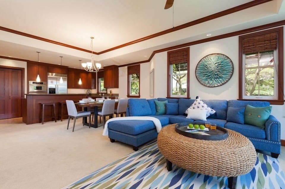 Open concept layout connects living room, dining, and kitchen