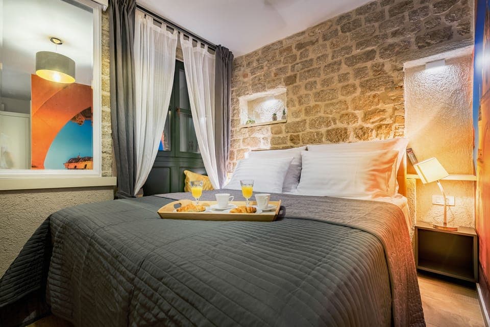 Standard Double Room | Minibar, in-room safe, desk, blackout drapes