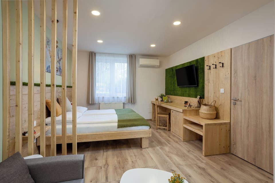 Desk, laptop workspace, bed sheets