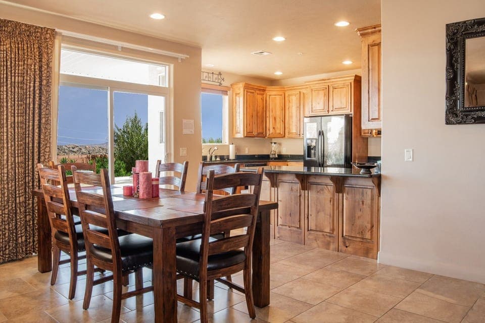 Dining table pulls out to seat 10 + 2 at counter