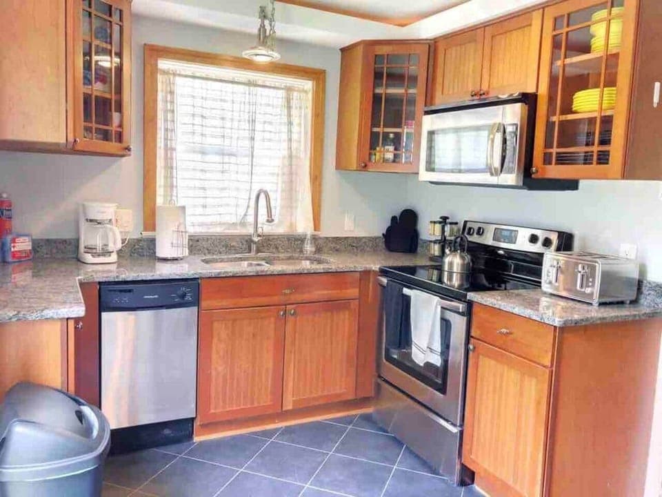 Kitchen includes dishwasher,  microwave, toaster & coffee maker