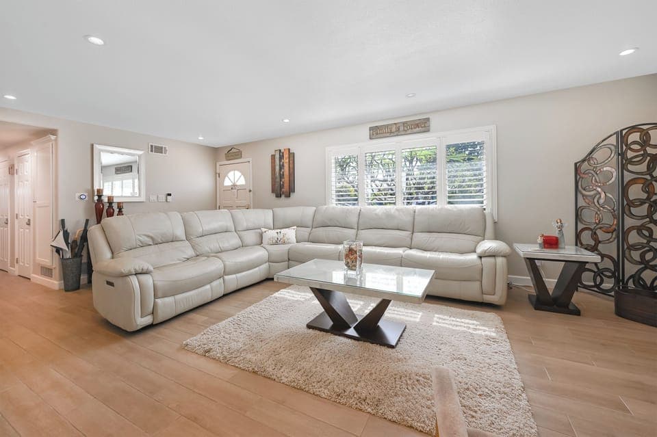 Livingroom and Leather couch with 3 built in recliners