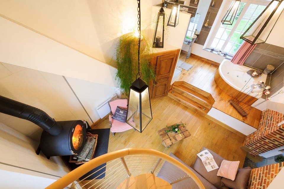 Suite (Lune de Miel Triplex spiral stairs) | Living area | Flat-screen TV