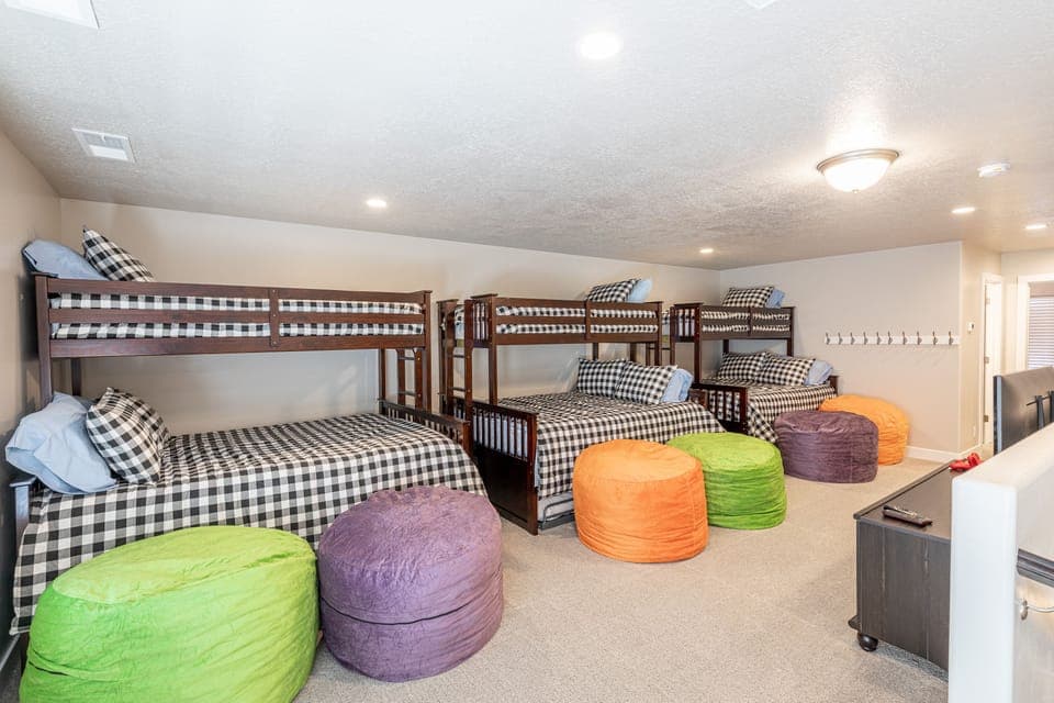Upstairs Loft - This upstairs loft has three Twin over Queen bunk beds with twin trundles.