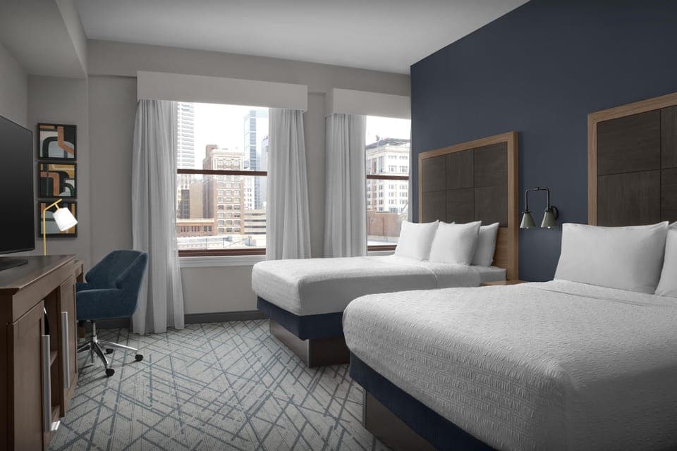 Desk, blackout drapes, iron/ironing board, free cribs/infant beds