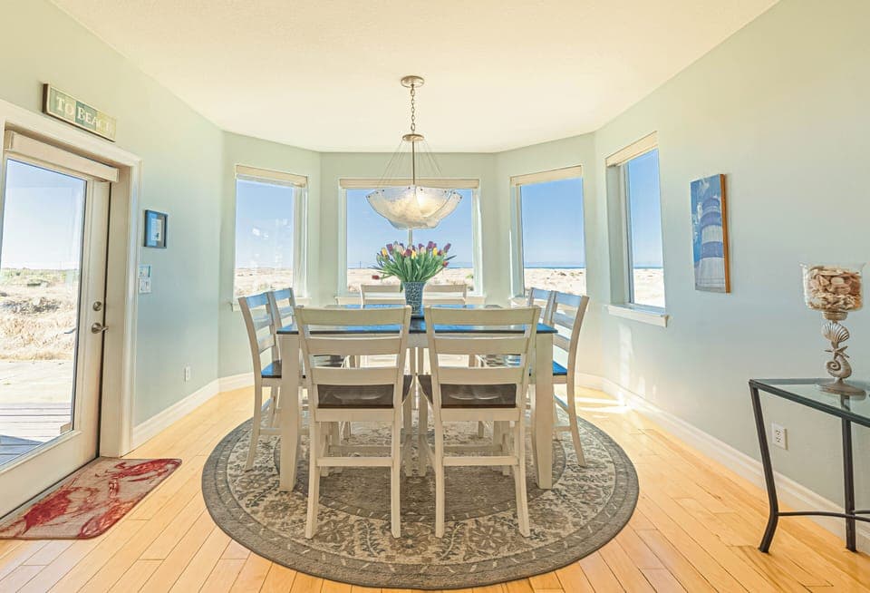 Dining room with great views & seating for 8, 4 additional seats at kitchen bar